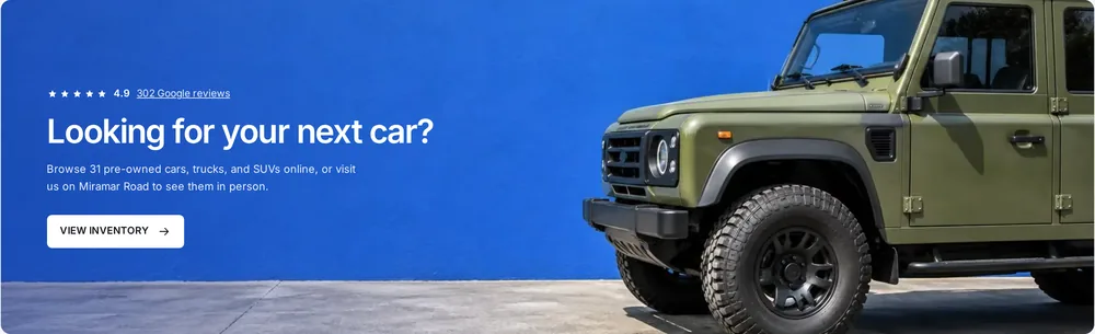 Iconic Coach banner: Looking for your next car? with a View Inventory button.